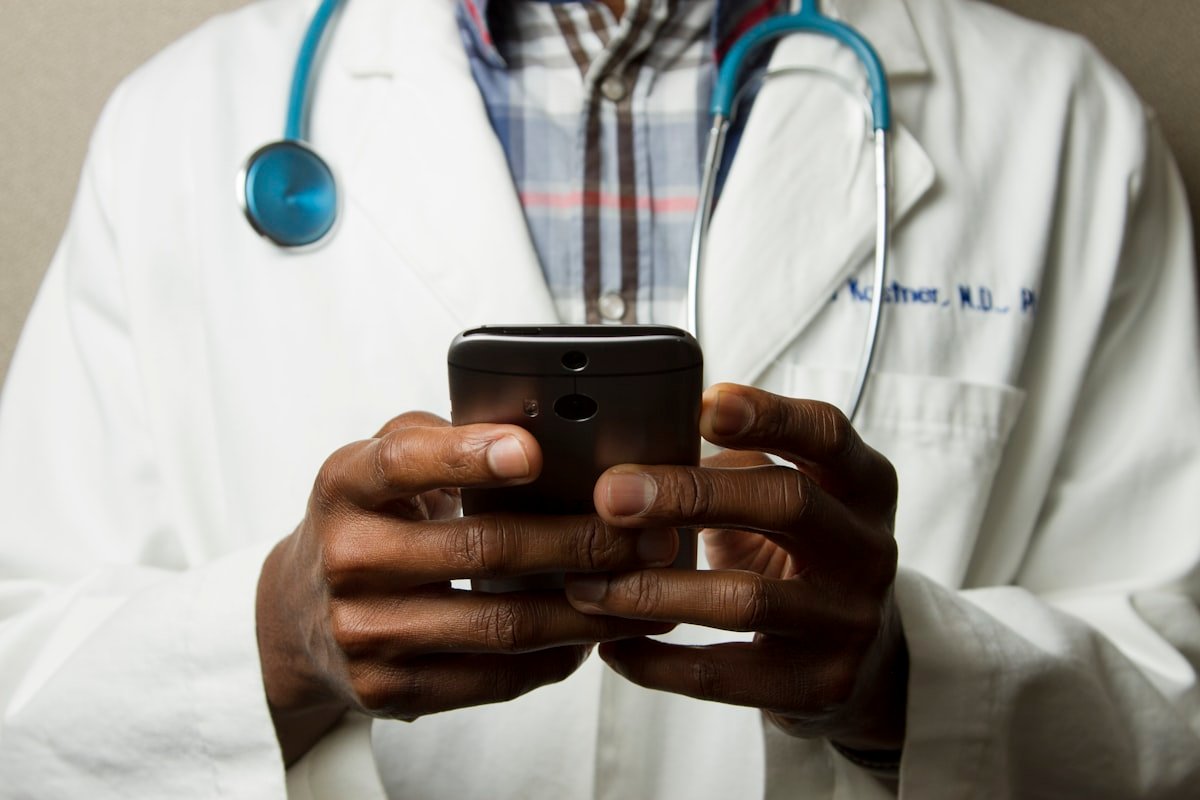 healthcare professional using digital tools to verify patient insurance and ensure compliance