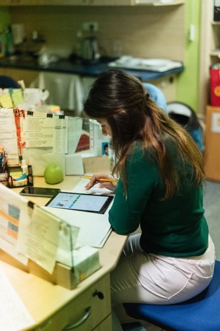 pexels photo 18459248.jpg Healthcare professionals using a tablet for efficient documentation and billing management.