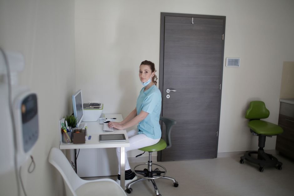 Medical biller analyzing electronic charts to eliminate routine podiatry billing errors