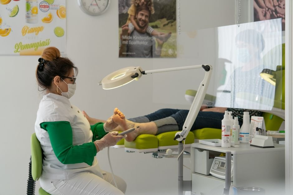 Podiatrist reviewing patient foot care documentation for accurate podiatry billing compliance