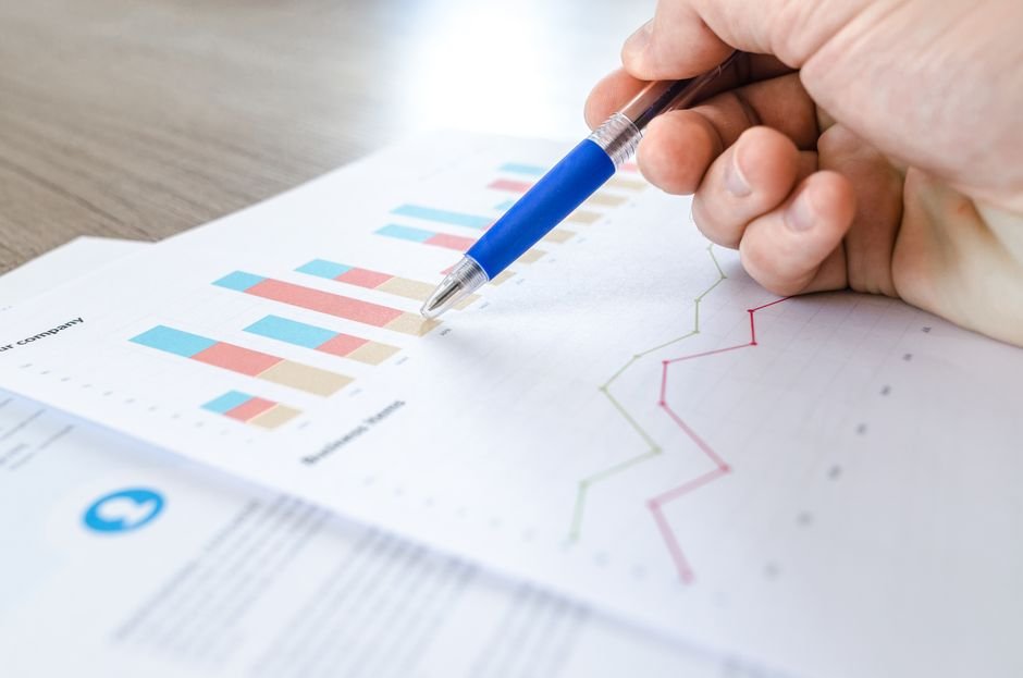 pexels photo 590022.jpg A physician studies complex financial spreadsheets, evaluating reimbursement rates for effective payer contract negotiation.