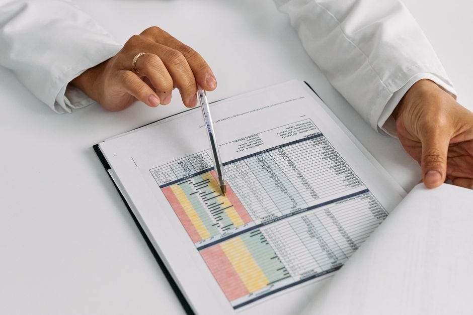 pexels photo 7578799.jpg Medical professionals reviewing patient charts for documentation improvement strategies.