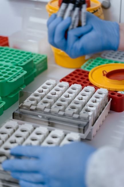 Laboratory technician meticulously handles test tubes and samples, ensuring accurate lab billing data.