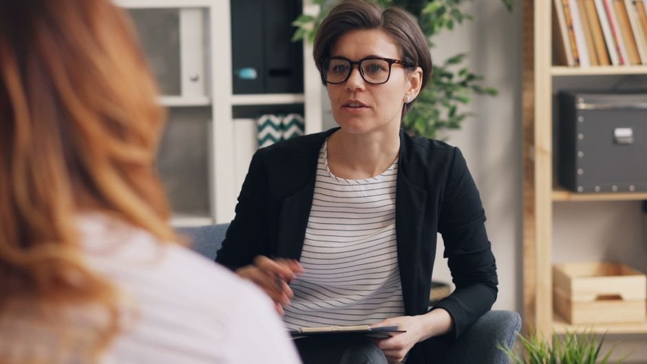 Medical billing professional discussing obesity treatment with a colleague