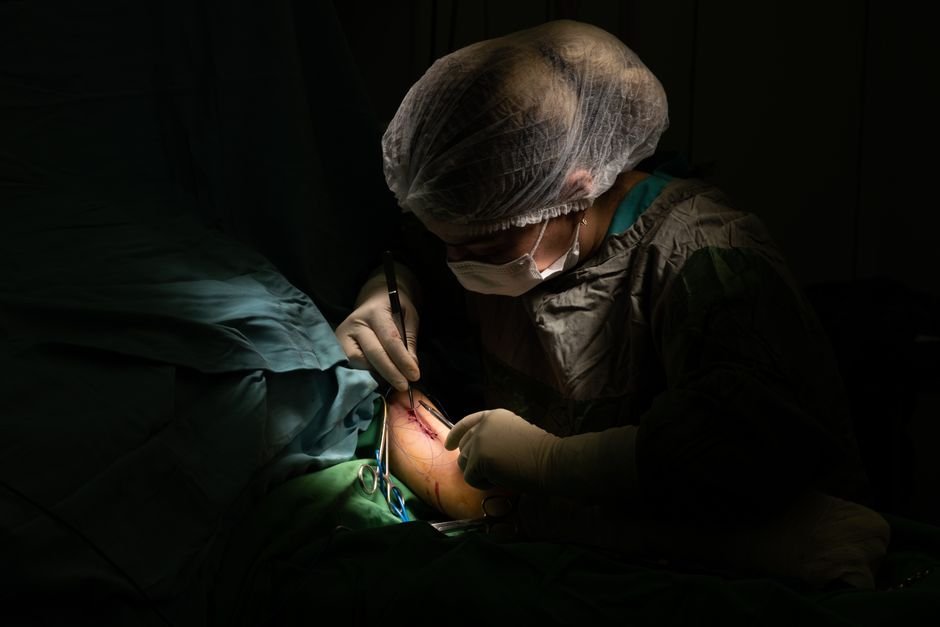pexels photo 35914203.jpg Podiatric surgeons performing a foot bunionectomy procedure in a sterile operating room