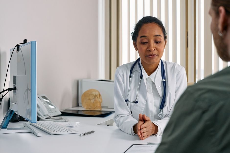 pexels photo 7579823.jpg Medical professional explaining complex financial policies for self-pay collections to patient