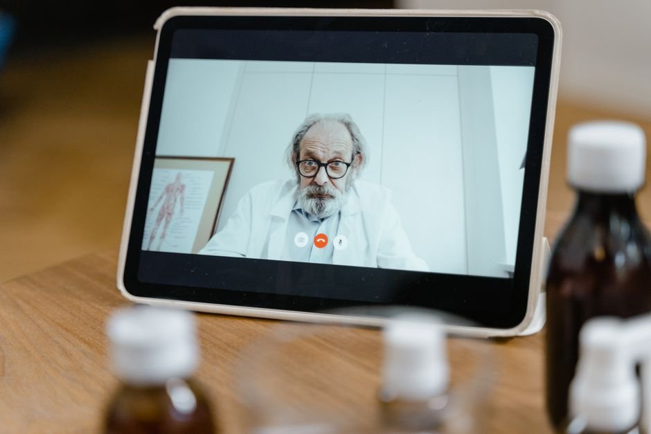 pexels photo 8376207.jpg Healthcare provider conducting a virtual consultation with a patient on a screen, discussing telemedicine CPT codes.